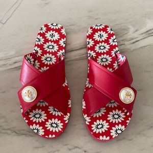 Tory Burch red slide on sandals with brooch